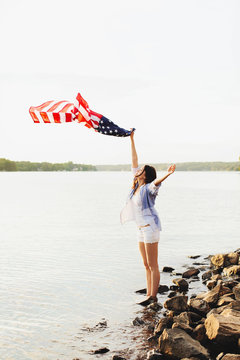 Girl waving an american flag 