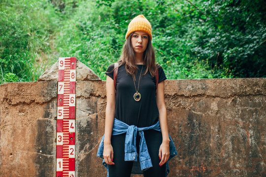 Portrait of a young hipster woman standing on outdoors.