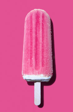 Pink popsicle on a pink background