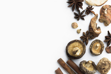 Herbs include ginger, cinnamon anise cardamom on a white background Chinese medicine brown sauce...