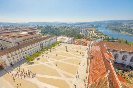 Coimbra uptown aerial view from top of bell clock tower. Coimbra University courtyard and Mondego river on background. Coimbra in Central Portugal, is famous for its University, the oldest in Europe.