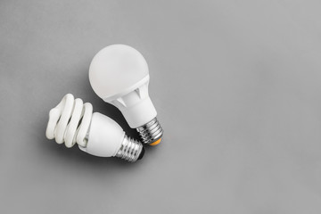 Compact fluorescent light bulb on gray background, Idea concept lamp.