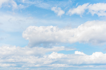Blue sky with white clouds, cloudscape background.