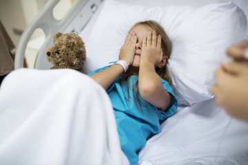 Young Caucasian girl staying at a hospital