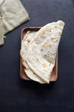Roti on wooden plate