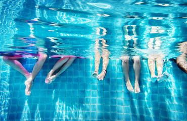 Group of people legs underwater
