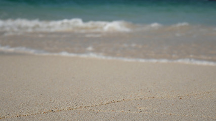 Fototapeta na wymiar soft wave of the blue sea , clear water on the white sand beach with copy space area. summer sea sandy beach for holiday background wallpaper