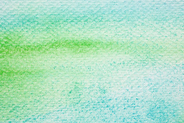Green and blue abstract watercolor painting textured on white paper background