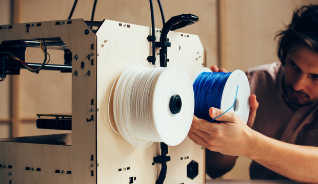 Technician working with 3d printer