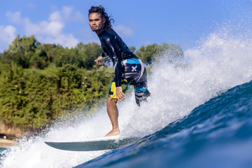 Fototapeta na wymiar Indonesia, Bali, man surfing