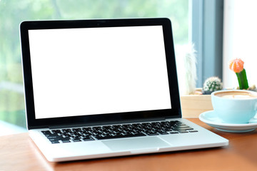 Fototapeta premium Laptop, notebook computer with blank screen on wood table by window background, mock up display, business and technology, online education, technology lifestyle concept