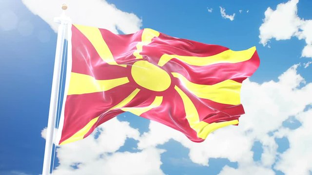 Realistic flag of Macedonia waving against time-lapse clouds background. Seamless loop in 4K resolution with detailed fabric texture.