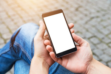 Man uses his Mobile Phone outdoor