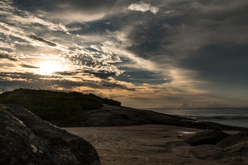 sunny morning between clouds on Guaratuba beach