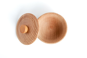 Empty wooden bowl with cover on white background.