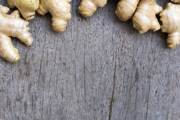 Closeup ginger roots with wood background, coppy space for text or ginger product concept
