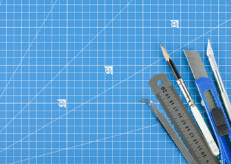 Concept of Architects workspace with plans and professional tools.