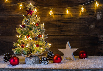 Merry Christmas decoration with Christmas tree, lights, ornaments and snow