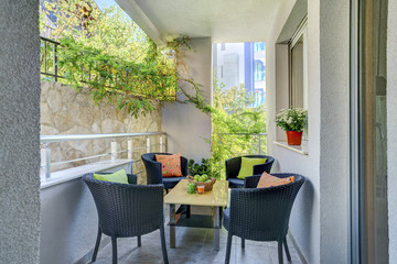 Terrace of a private apartment, decorated table with fuits