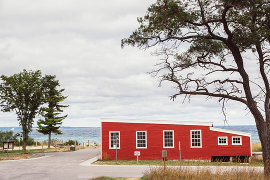 Red historic building on lake michigan