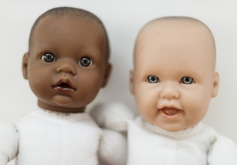 Caucasian and black baby dolls