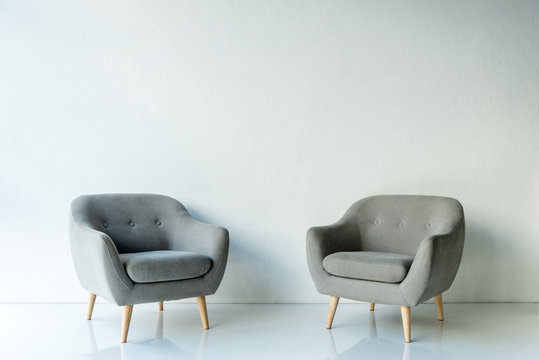 Two gray armchairs
