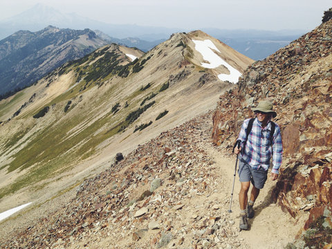 Man hiking trail in mountains
