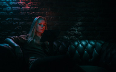 woman using tablet in bar