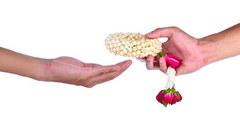 Thai Flower Garland in hand holding isolated on white