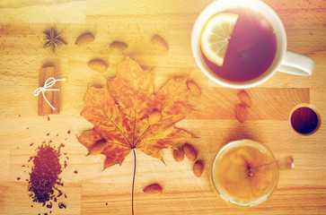 cup of lemon tea and honey on wooden board