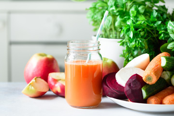 Fresh juice or smoothie, fruits and vegetable - apples, carrot, beet, celery, cucumber, greens, herbs. Vegetarian, raw food concept, clean eating, detox