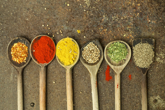 Colourful spices on the spoons