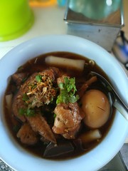 Chinese roll noodle soup whit egg and chicken. 