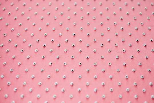 Plastic Googly Eyes arranged in a pattern on a pink background