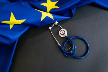 Cost of health care concept, stethoscope and calculator on document and eu flag © yavdat