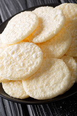 sweet crispy rice cakes close-up on a plate. vertical