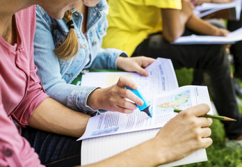 Students doing homework in the park