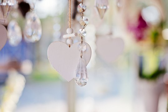 Hanging white wooden heart with transparent crystals