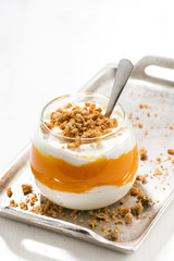dessert with pumpkin, sweet cream and cookies, vertical