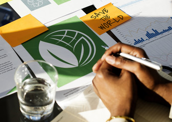 A Person Reading Over Sets of Document