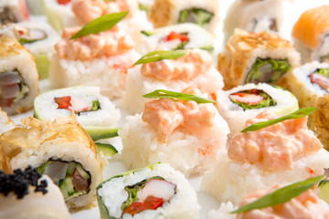 Closeup on japanese sushi rolls,maki on white background