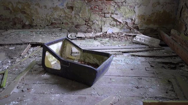 Chernobyl, Ukraine - 17th of June 2017: Visit to Zalesye village in Chernobyl zone - 4K Baby pram left in old house