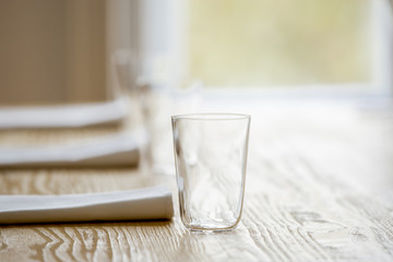 glasses and serviettes on the table