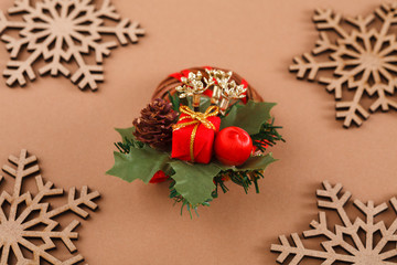 Wood snowflakes, creative wreath in the center on beige background