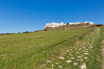 Fototapeta na wymiar Stone path to Spis Castle against clear blue sky, Slovakia.