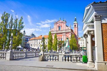 The famous "Triple Bridge" on Ljubljanica river (Ljubljana city center - Slovenia - Europe) - People are not recognizable.