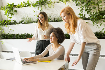 Three young businesswomen in the office