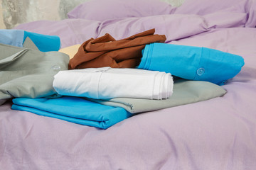 stacks colourful bed linen textiles clothing background pile concept
