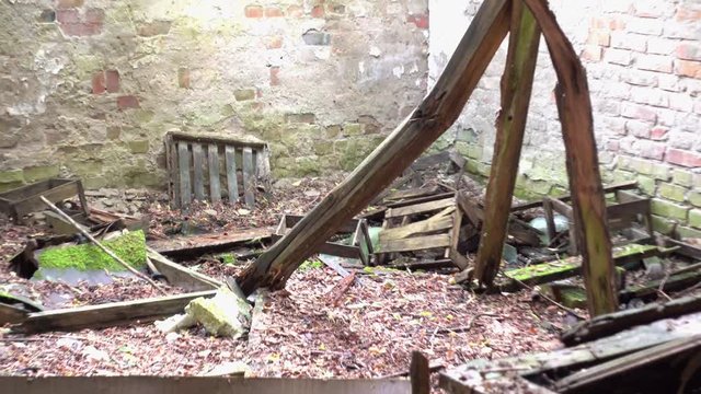 Chernobyl, Ukraine - 17th of June 2017: Visit to Zalesye village in Chernobyl zone - 4K Inside of collapsing house