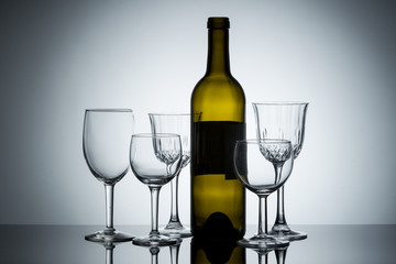 Assortment of wine glasses and a bottle.